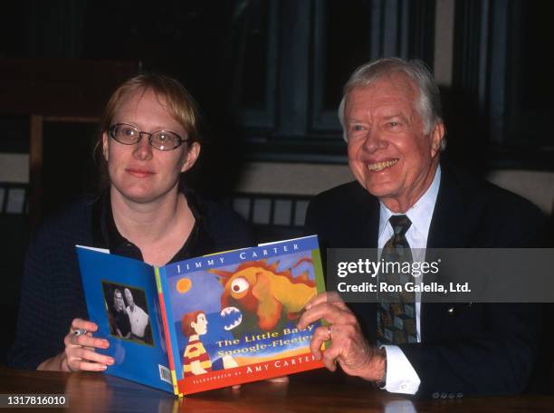 Amy Carter and Jimmy Carter attend "The Little Baby Snoogle-Fleejer" Book Party at Barnes and Noble in New York City on December 13, 1995.