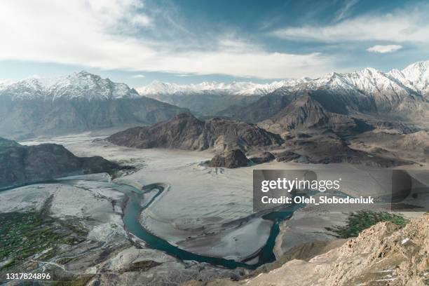 scenic view of river down in the valley in northern pakistan - indus valley stock pictures, royalty-free photos & images