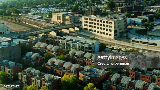 warehouses and condos by the railroad tracks in omaha - aerial - omaha nebraska stock pictures, royalty-free photos & images