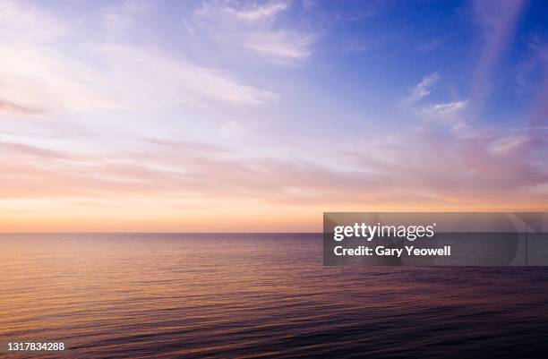seascape and sky - sky pink clouds stock pictures, royalty-free photos & images