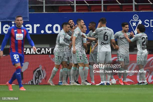 Andres Guardado ) of Real Betis celebrates with team mates after scoring the opening goal during the La Liga Santander match between SD Eibar and...