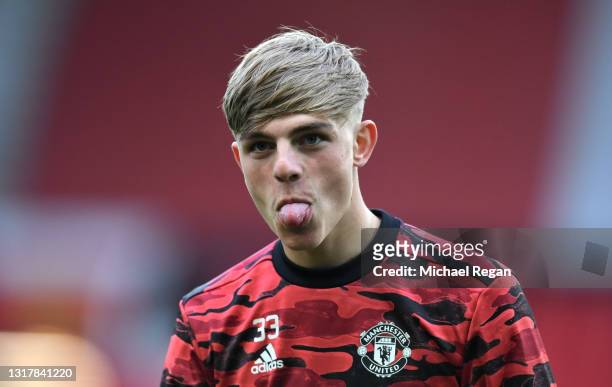 Brandon WIlliams of Manchester United reacts as he warms up prior to the Premier League match between Manchester United and Liverpool at Old Trafford...