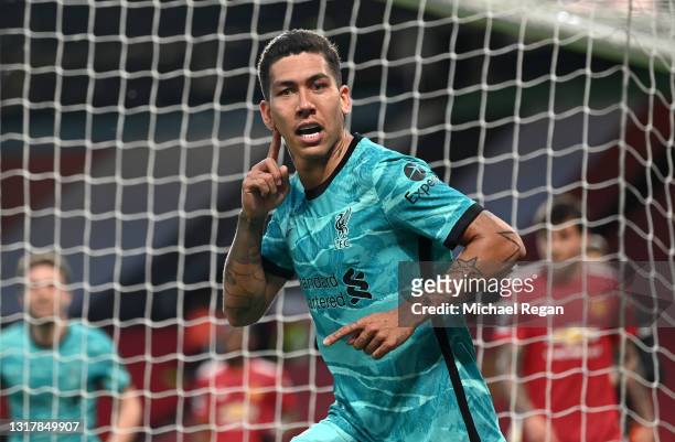 Roberto Firmino of Liverpool celebrates after scoring their side's second goal during the Premier League match between Manchester United and...