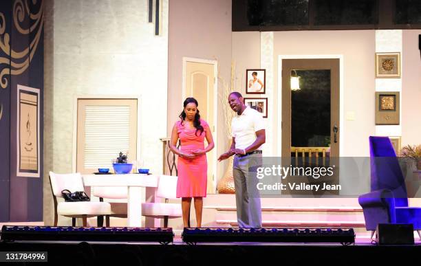 Vivica A. Fox and Brian Mcknight perform during the Je'Caryous Johnson stage play 'Cheaper to Keep Her' at James L Knight Center on February 18, 2011...