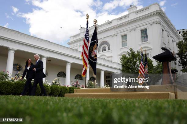 President Joe Biden leaves with Vice President Kamala Harris after he delivered remarks on the COVID-19 response and vaccination program in the Rose...