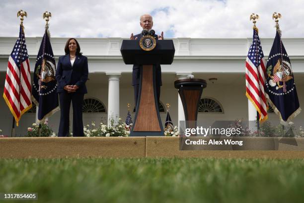 President Joe Biden delivers remarks on the COVID-19 response and vaccination program as Vice President Kamala Harris listens in the Rose Garden of...