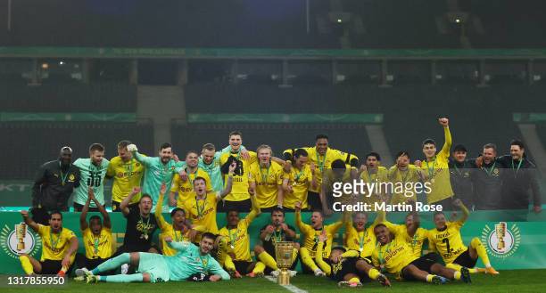 Players of Borussia Dortmund celebrate with the trophy after the DFB Cup final match between RB Leipzig and Borussia Dortmund at Olympic Stadium on...