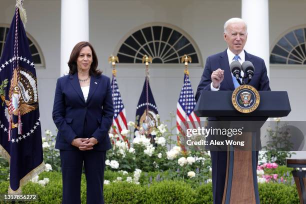 President Joe Biden delivers remarks on the COVID-19 response and vaccination program as Vice President Kamala Harris listens in the Rose Garden of...