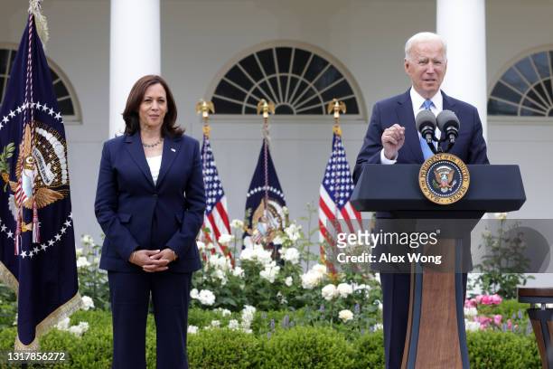 President Joe Biden delivers remarks on the COVID-19 response and vaccination program as Vice President Kamala Harris listens in the Rose Garden of...