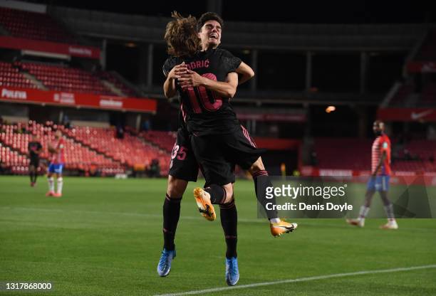 Luka Modric of Real Madrid celebrates with Miguel Gutierrez of Real Madrid after scoring their team's first goal during the La Liga Santander match...