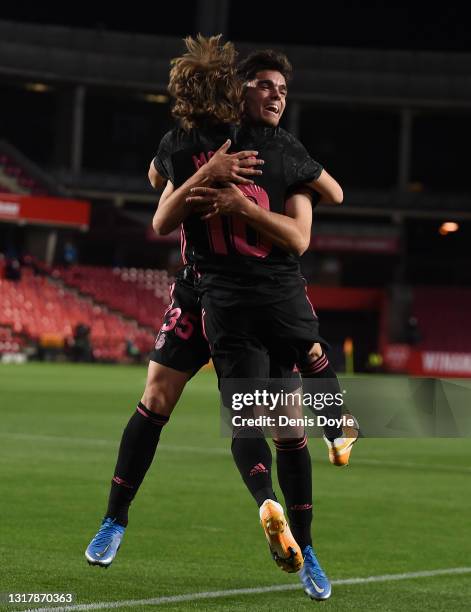 Luka Modric of Real Madrid celebrates with Miguel Gutierrez of Real Madrid after scoring their team's first goal during the La Liga Santander match...