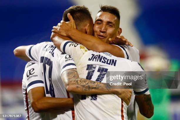 Federico Mancuello of Velez celebrates with teammates after scoring the third goal of his team during a match between Velez and Liga Deportiva...