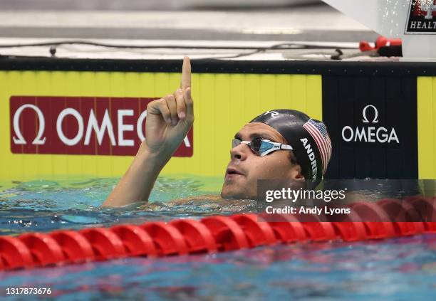 Michael Andrew celebrates after swimming to victory in the Men 100 Meter Breaststroke during the TYR Pro Swim Series at Indianapolis at IU Natatorium...