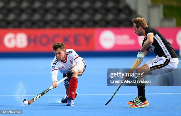 Tom Sorsby of Great Britain hits it past Niklas Wellen of Germany during the FIH Hockey Pro League match between Great Britain Men and German Men at...