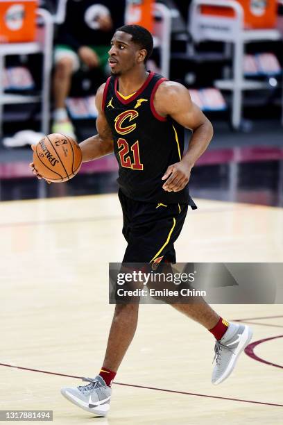 Damyean Dotson of the Cleveland Cavaliers drives the ball against the Boston Celtics during their game at Rocket Mortgage Fieldhouse on May 12, 2021...