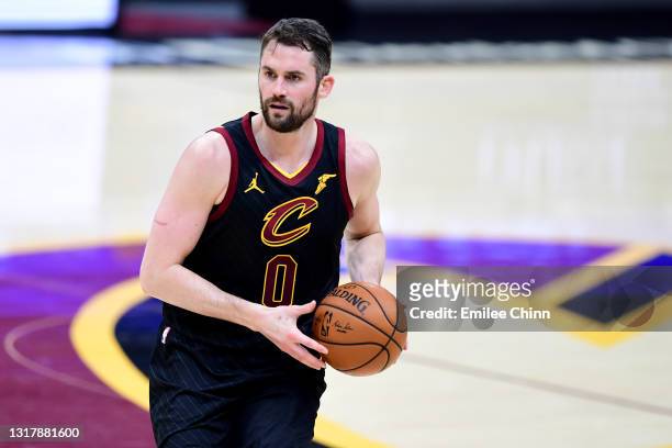 Kevin Love of the Cleveland Cavaliers drives the ball against the Boston Celtics during their game at Rocket Mortgage Fieldhouse on May 12, 2021 in...