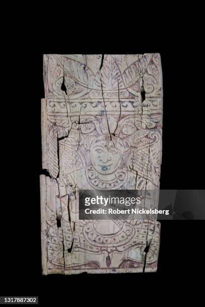 Winged tree-spirit with a headdress from the first century CE is depicted on this bone plaque from Begrem, Kapisa province on display at the National...
