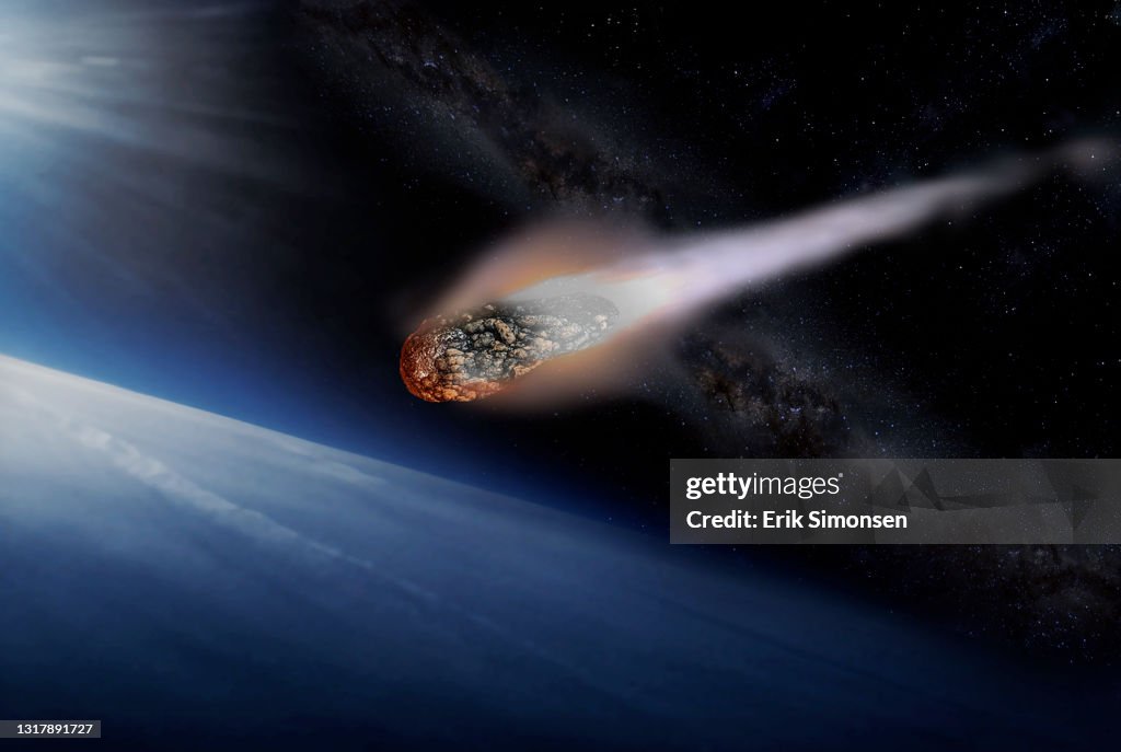 A large asteroid entering the Earth’s atmosphere. NASA continually monitors the potential threat from large asteroids to Earth.