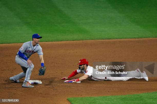 Bryce Harper of the Philadelphia Phillies in action against Jeff McNeil of the New York Mets during a game at Citizens Bank Park on May 2, 2021 in...