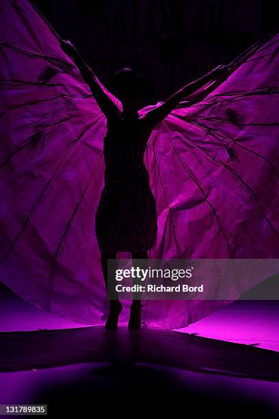 Presenter Karima Charni, dressed by Johana Riplinger for Maison Arnaud Larher and Ethos, walks the runway at the Salon Du Chocolat 2010 Opening Night...