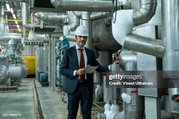 engineer or manager working in boiler room. - kyltråg bildbanksfoton och bilder