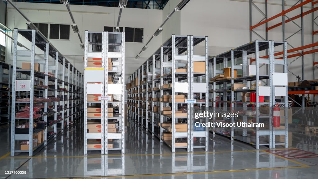 Rows of material boxes or product boxes in warehouse area.