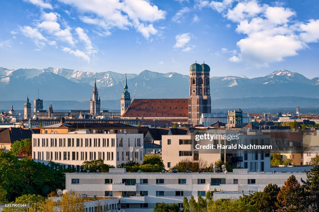 Old Town with Cathedral against mountain range, Munich, Bavaria, Germany