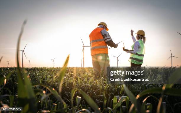 windmill engineers inspection and progress check wind turbine - responsibility stock pictures, royalty-free photos & images
