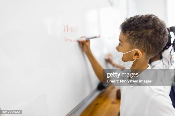 Writing In Board School Student Writing On Board Photos and Premium High Res Pictures - Getty ...