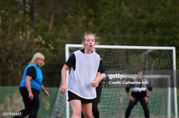 women compete in a football match - menopossibilities stock pictures, royalty-free photos & images