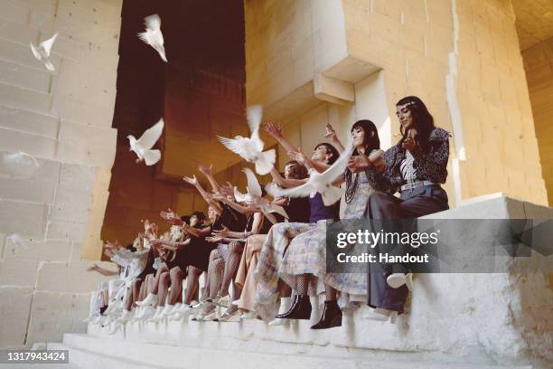 In this handout released on May 14th, models pose for the final on runway during the Chanel Cruise 2021/2022 Collection Show at the Carrières de...