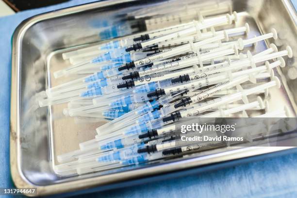 Syringes with Pfizer-BioNTech Covid-19 vaccines are seen in a vaccination center in La Fira de Cornellà del Llobregat on May 11, 2021 in Barcelona,...