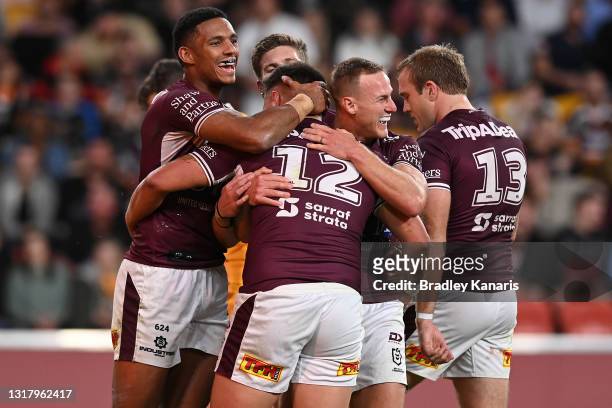 Josh Schuster of the Sea Eagles celebrates with Daly Cherry-Evans of the Sea Eagles after scoring a try during the round 10 NRL match between the...