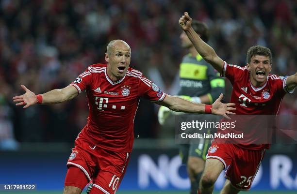 Arjen Robben of FC Bayern Muenchen celebrates scoring his side's second and winning goal during the UEFA Champions League final match between...