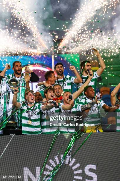 Sporting CP players celebrate with the trophy wining the game and become Champions at the of the match of the Liga NOS match between Sporting CP and...