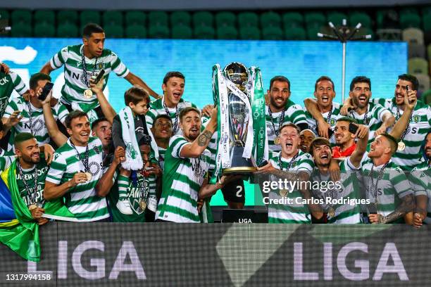 Sporting CP players celebrate with the trophy wining the game and become Champions at the of the match of the Liga NOS match between Sporting CP and...