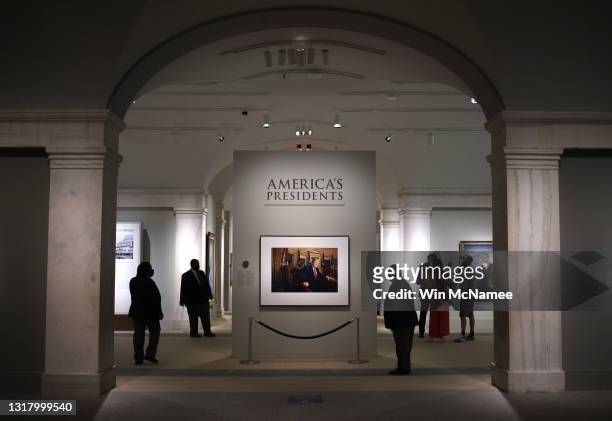 Patrons view a portrait of former U.S. President Donald Trump in the America’s Presidents exhibition at the National Portrait Gallery as the...