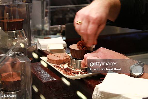 Chef prepares chocolate sample to give to Jean-Pierre Raffarin at the Salon Du Chocolat 2010 Opening Night at Parc des Expositions Porte de...