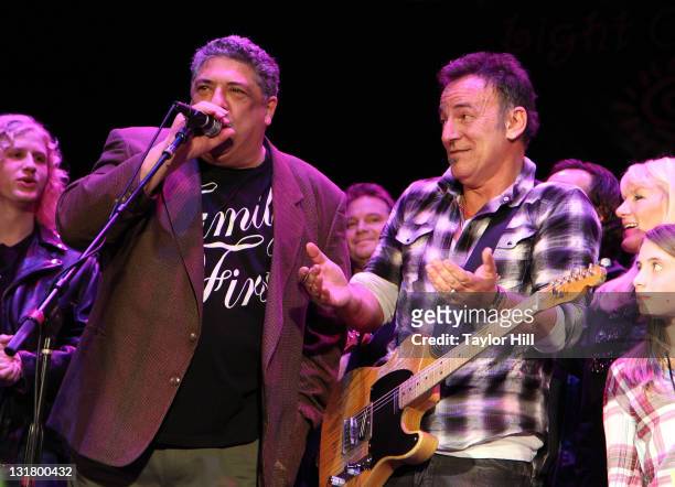 Vincent Pastore and Bruce Springsteen perform during the 11th Annual Light of Day benefit concert on January 15, 2011 in Asbury Park, New Jersey.