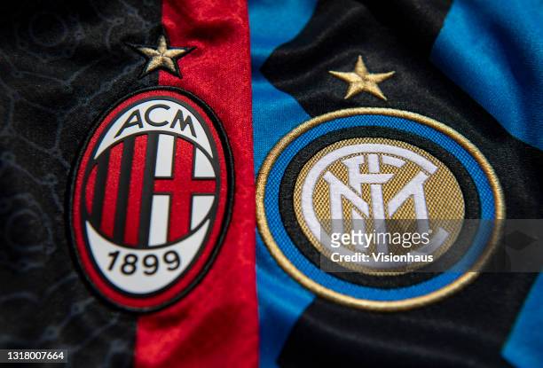 The club badges of AC Milan and Inter Milan on their first team home shirts on May 14, 2021 in Manchester, United Kingdom.