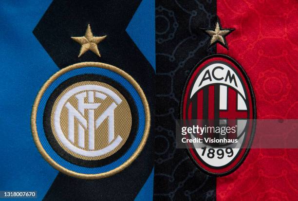 The Inter Milan and AC Milan badges on their first team home shirts on May 14, 2021 in Manchester, United Kingdom.