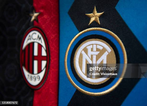 The club badges of AC Milan and Inter Milan on their first team home shirts on May 14, 2021 in Manchester, United Kingdom.