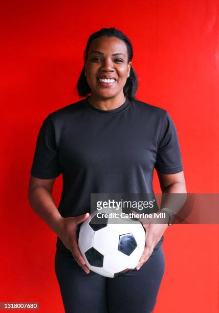 portrait of confident female soccer player - menopossibilities stock-fotos und bilder