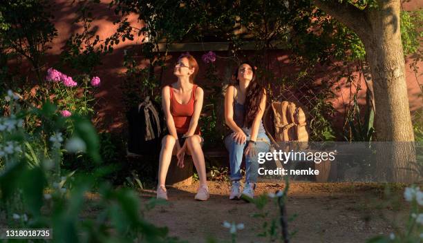 happy friends enjoying a trip together - bus bench stock pictures, royalty-free photos & images