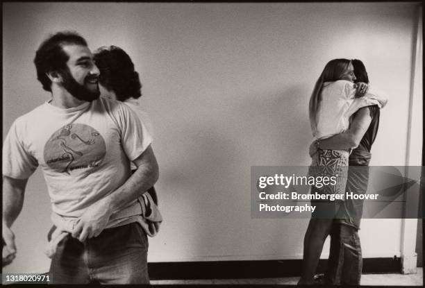 View of a pair of young couples on a concourse at Bill Graham Auditorium, San Francisco, California, January 28, 1987. They were there to attend a...