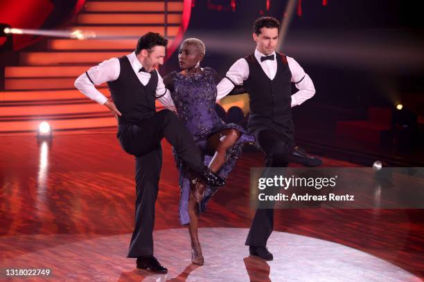 Auma Obama , Robert Beitsch and Andrzej Cibis perform on stage during the 10th show of the 14th season of the television competition "Let's Dance" on...