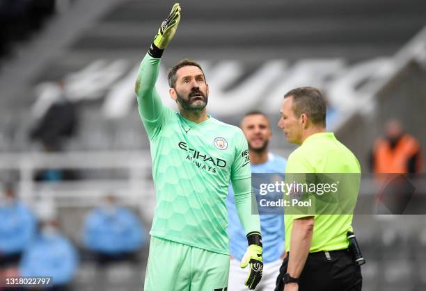 Scott Carson of Manchester City interacts with Match Referee, Kevin Friend during the Premier League match between Newcastle United and Manchester...