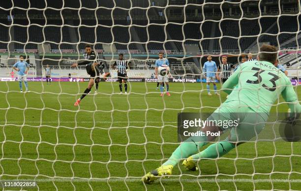 Joelinton of Newcastle United scores their side's second goal from the penalty spot past Scott Carson of Manchester City during the Premier League...