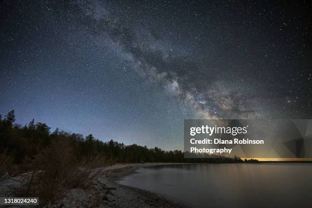 the milky way over lake michigan at the headlands international dark sky park near mackinaw city, michigan - headland stock pictures, royalty-free photos & images