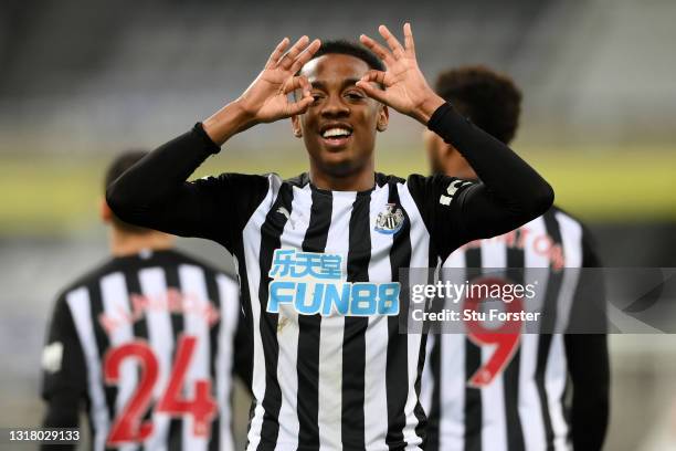 Joe Willock of Newcastle United celebrates after scoring their sides third goal, missing from the penalty spot but scoring the rebound during the...